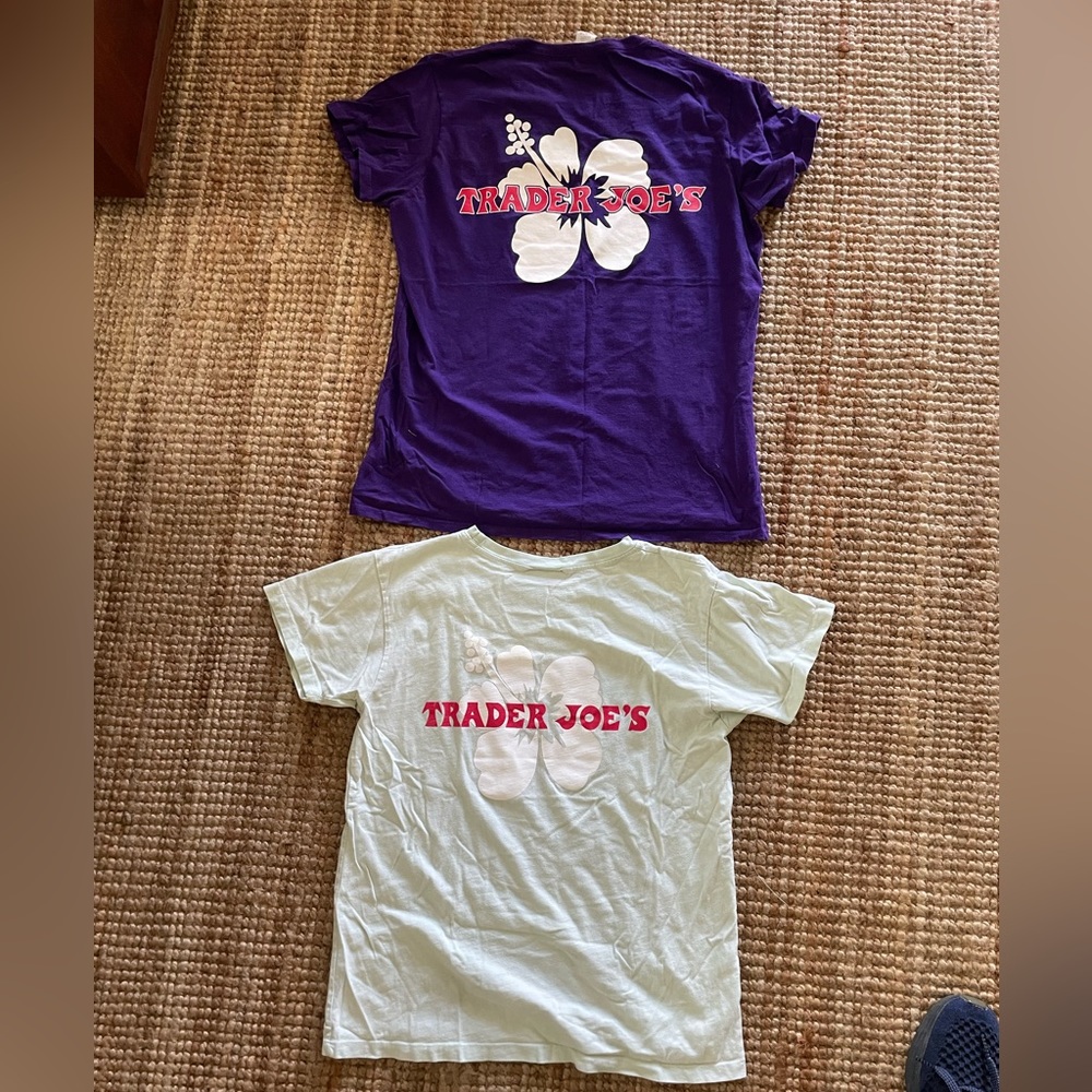 Two women’s Trader Joe’s tees. Purple women’s large. Seafoam women’s medium